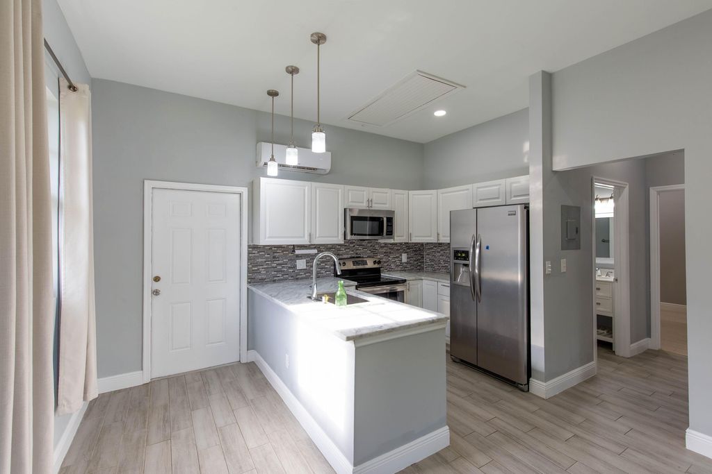 Photo of 13428 N 87th St Street N #Guest House, The Acreage, FL 33412 (MLS # B26017748)