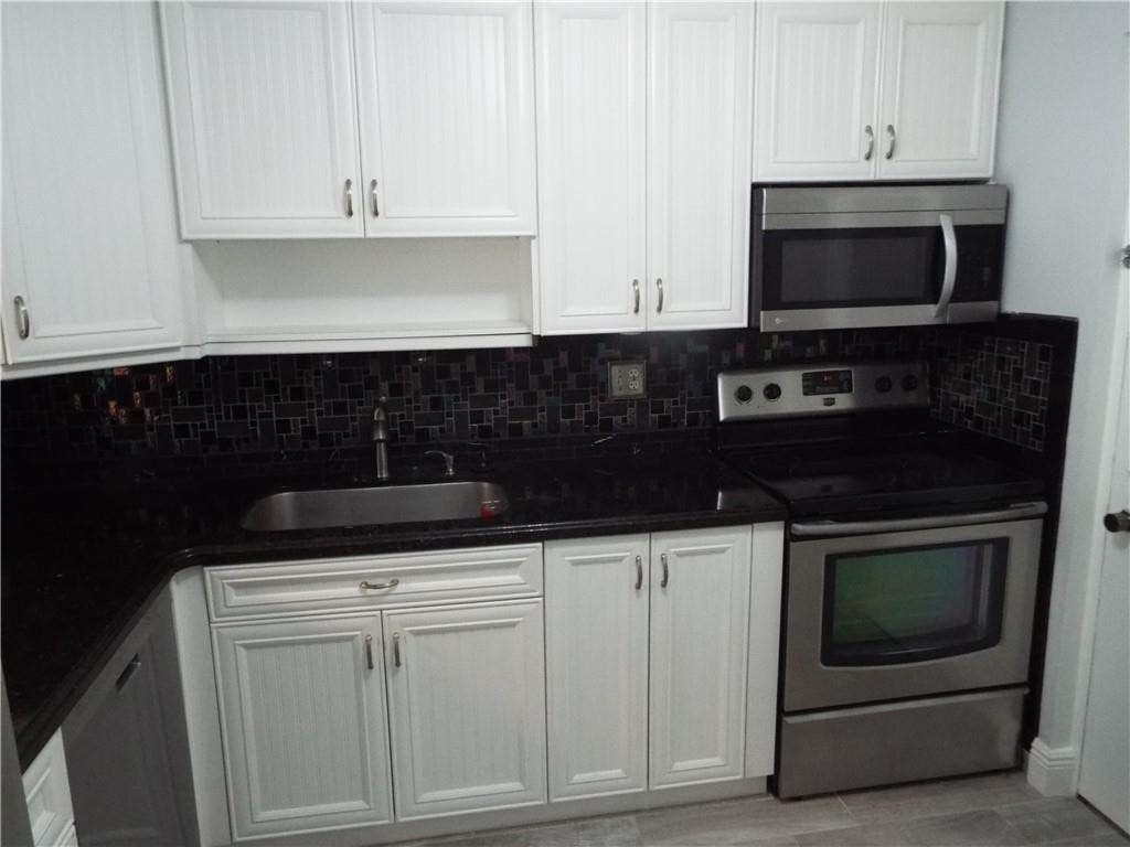Photo of 2311 S Cypress Bend Drive #219A, Pompano Beach, FL 33069 (MLS # F10412204)