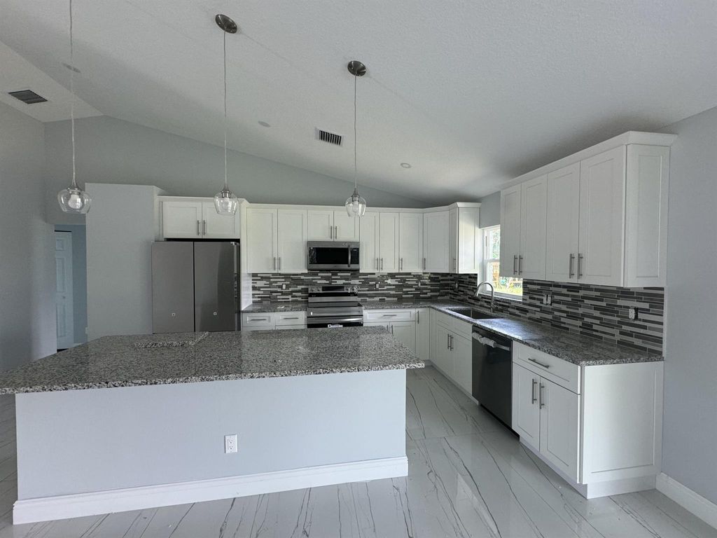 Photo of 414 Willows Avenue, Port Saint Lucie, FL 34952 (MLS # R10994230)