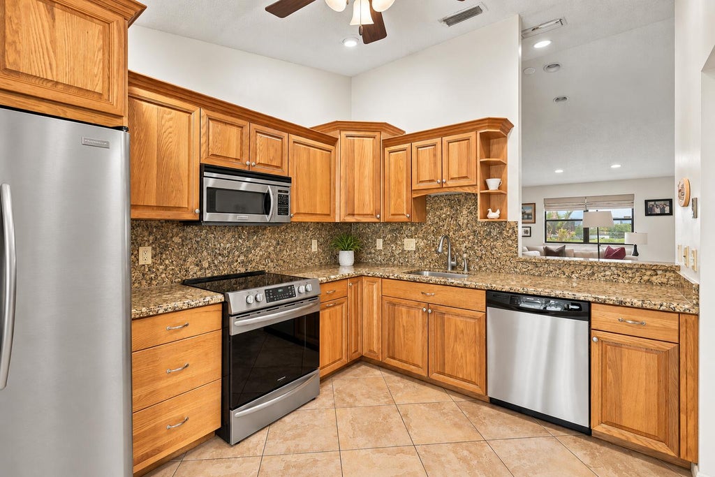 Photo of 459 KNOLLWOOD Court #459, Royal Palm Beach, FL 33411 (MLS # B26079673)