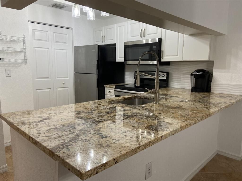 Photo of 2812 Grande Parkway #202, Palm Beach Gardens, FL 33410 (MLS # R10874431)