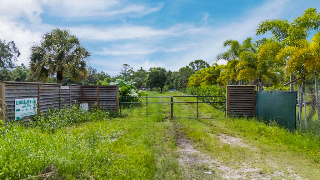 Photo of 6424 Park Lane W, Lake Worth Beach, FL 33449 (MLS # B26070603)