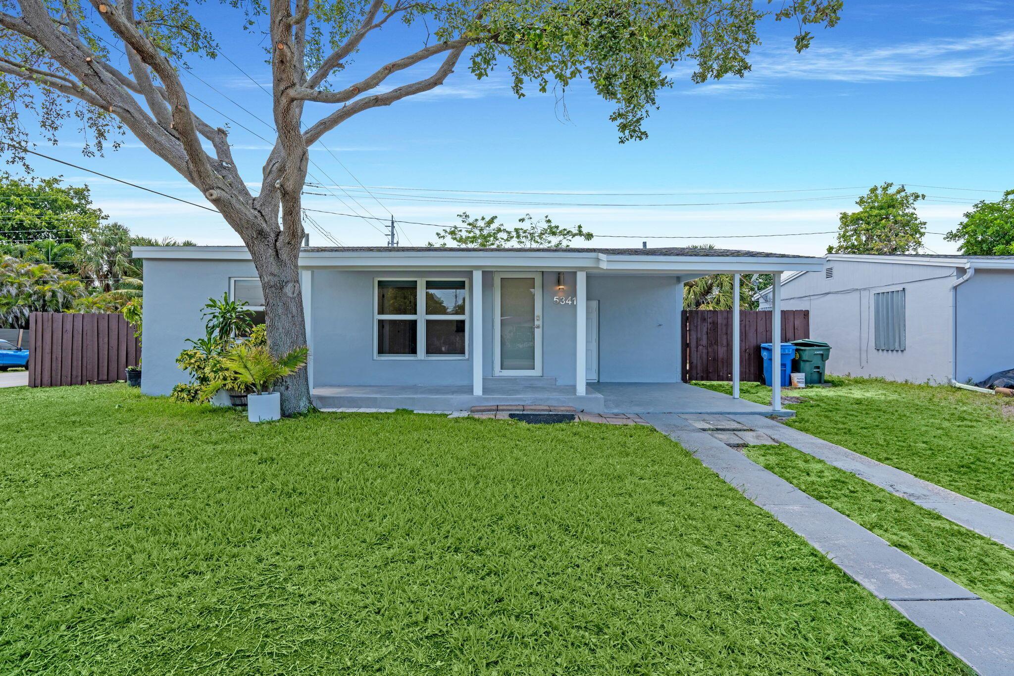 Welcome to this charming 3-bedroom, 2-bathroom home - featuring brand new tile flooring throughout, an upgraded kitchen with modern finishes, and in-home laundry convenience! Peace of mind with a newer roof, AC, and all IMPACT WINDOWS. Enjoy the comfort of dimmable lighting and an open-concept layout that flows seamlessly to the outdoors. The property boasts a private fenced yard with an inviting open pergola, perfect for entertaining or relaxing under the South Florida sun. Centrally located, you're just minutes from beaches, shopping, dining, and major highways. This home is MOVE IN READY! Schedule your private showing today.