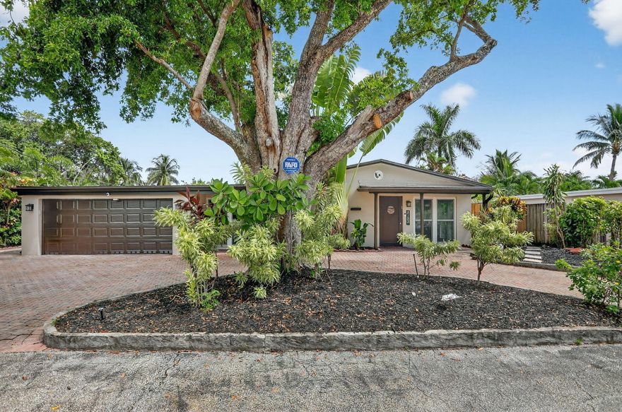 Welcome to your tropical retreat in Wilton Manors! This updated waterfront home offers the best of indoor & outdoor living. 2018 Roof & Impact Windows. Enjoy 70' of water front with ocean access, a sparkling pool, lush landscaping, and multiple outdoor entertaining areas including a covered patio with fans & dining space. Inside, natural light fills the open floor plan with spacious living areas, wood-style floors, and a stylish kitchen featuring wood cabinetry, granite counters & stainless appliances. The primary suite and second bedroom boasts oversized windows with water views. Modern baths, updated finishes & tropical curb appeal complete this gem. Just minutes to Wilton Drive, beaches & downtown Fort Lauderdale--don't miss this rare opportunity for South Florida living at its finest!