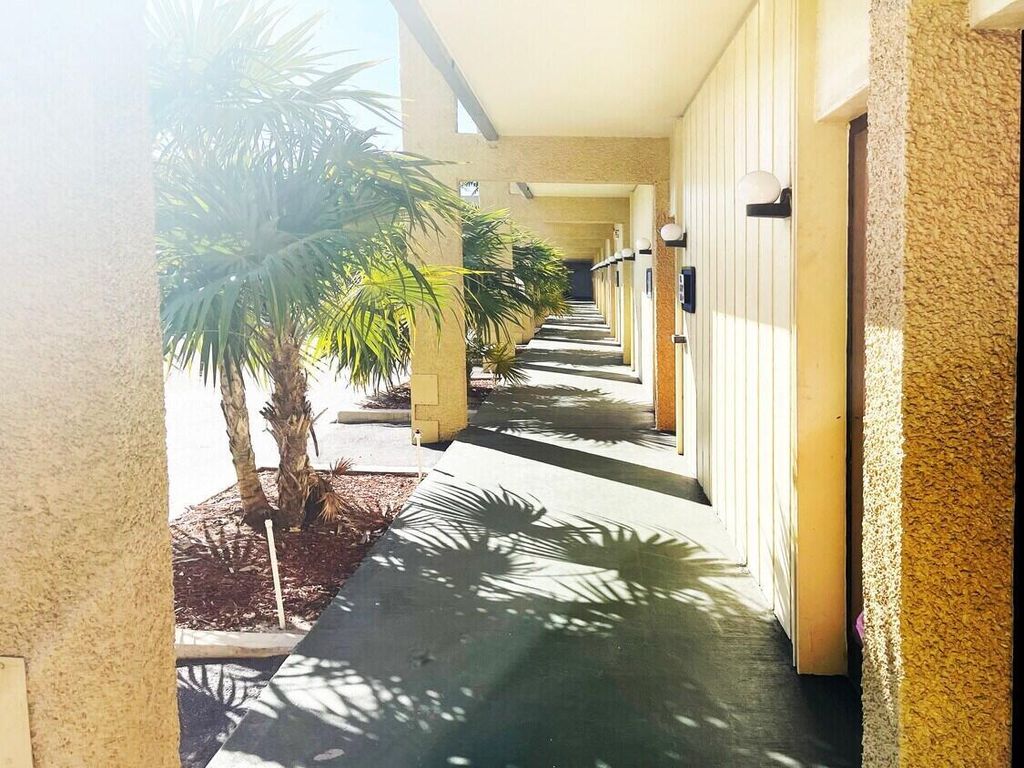 Photo of 2331 N State Rd 7 #203, Lauderhill, FL (MLS # R10960225)