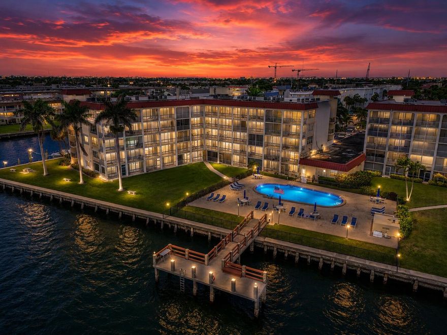 You will be awestruck by the complete renovation of this waterfront corner unit at Paradise Harbour with unobstructed views of the Intracoastal, Singer Island & Earman River. The kitchen has been totally redesigned, with new countertops & backsplash, white Shaker cabinets, a corner lazy Susan, pull-out spice rack & full pantry with roll-out shelves. All new stainless-steel range, refrigerator, dishwasher & microwave. Dry bar with wine fridge, upper cabinets & a rack for wine glasses. The new bathroom features a soaking tub, new floor & wall tiles & a new vanity with an LED-framed mirror. New impact windows in the kitchen & bedroom; new Italian Casa Dolce porcelain plank flooring throughout; all new lighting throughout. The transformed living area is accented by a built-in slatwall entertainment center & electric fireplace with floating live edge. New upgraded electrical panel; new water heater; filtered water system; built-ins in both closets; new smart programmable thermostat; all new baseboards & trim throughout. Paradise Harbour is a waterfront community with a heated pool on the Intracoastal. Store & launch your kayaks & paddleboards. Boat slips for purchase or lease (when available); common dock for fishing. There is a fitness center, community room, billiards & bike storage as well. Frigate's Waterfront Bar & Grill is walkable from the property. North Palm Beach is a paradise for water enthusiasts. MacArthur Beach State Park & North Palm Beach Country Club are popular nearby attractions. Make this pristine property your home!