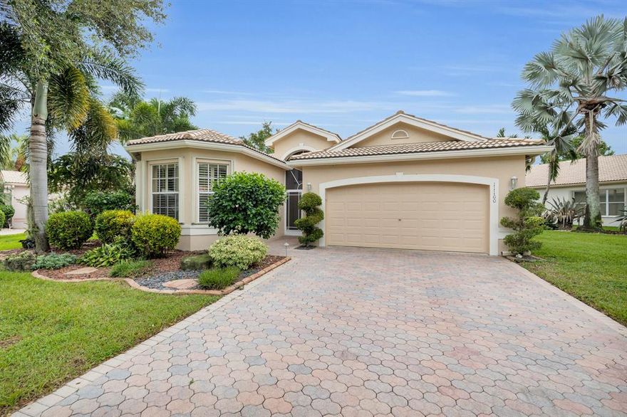 Highly sought after Mediterranean Model! This light & bright 3 bedroom (3rd room is currently used as a den/office), 2 bath home features an OPEN floor plan w/ a water view and custom landscaping. Professionally designed with the WALL DOWN making it the perfect home for every day enjoyment & entertaining. Custom designed kitchen with wood cabinets, wine cooler, and a large island great for gathering around or preparing home cooked meals. Move-in ready, this well loved home features tile on the diagonal throughout the main living area & BRAND new neutral colored carpeting in the bedrooms. Smooth walls, ceiling fans, recessed lighting, pocket doors, & a large tiled & screened enclosed lanai are just a few of the many features. Renovated clubhouse w/ Bistro & great amenities