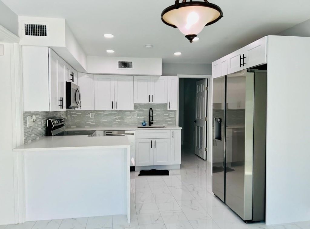 Photo of 314 Sunshine Drive, Coconut Creek, FL 33066 (MLS # B26017546)