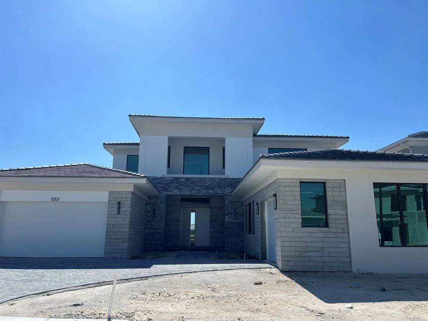 UNDER CONSTRUCTION - STUNNING SOUGHT AFTER DOMINICA FLOOR PLAN. 5 BEDS/ 6.5 BATHS WITH POOL ON LAKE AND THE FINEST OF FINISHES.