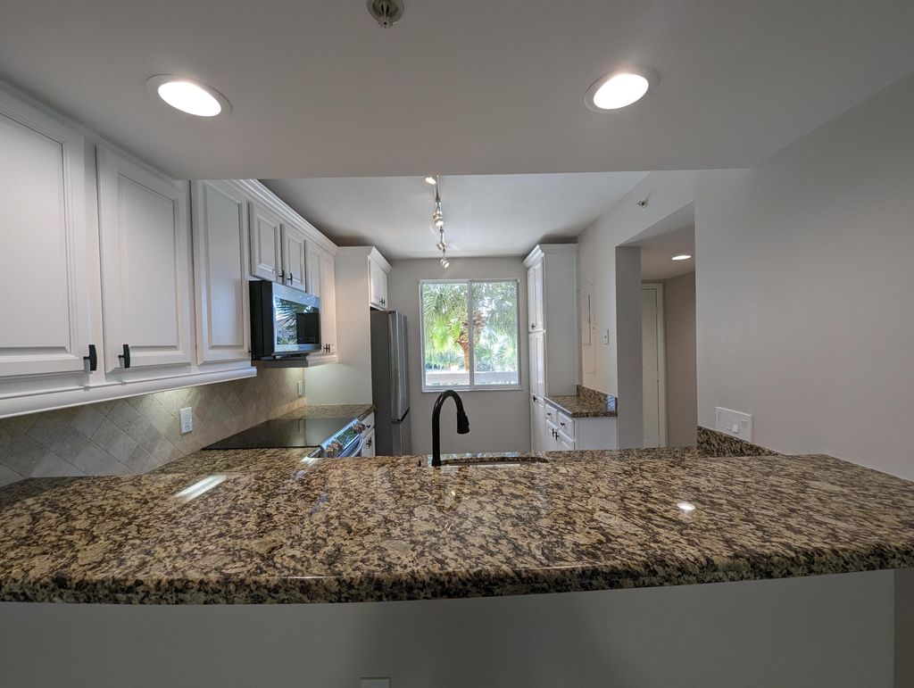 Photo of 2001 Marina Isle Way #305, Jupiter, FL 33477 (MLS # R11028044)