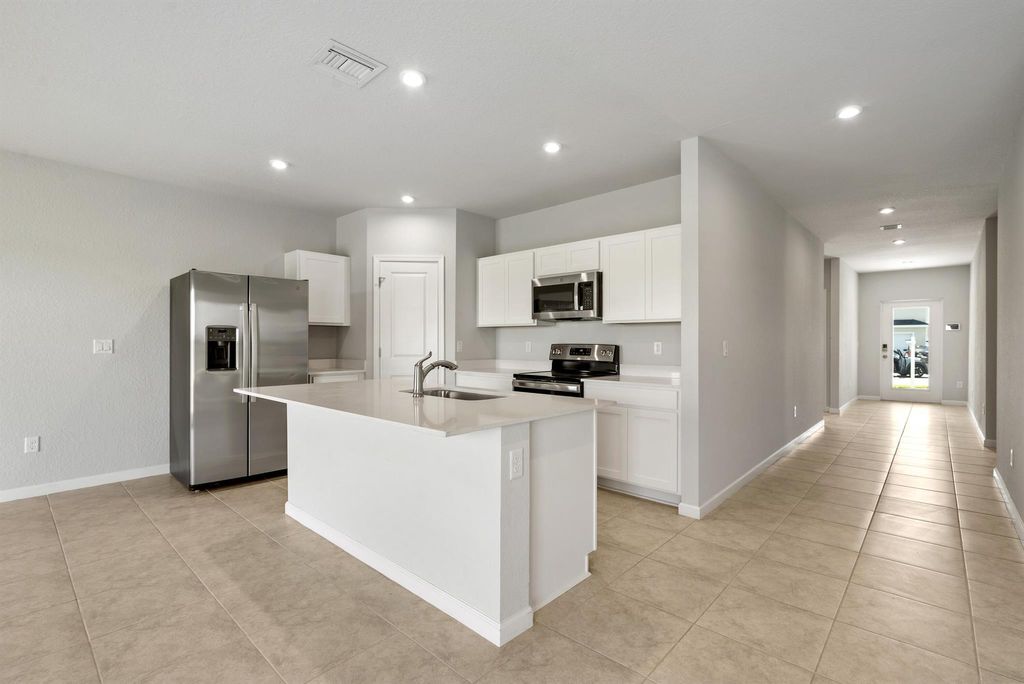 Photo of 126 Dabou Loop, Belle Glade, FL 33430 (MLS # R10998188)