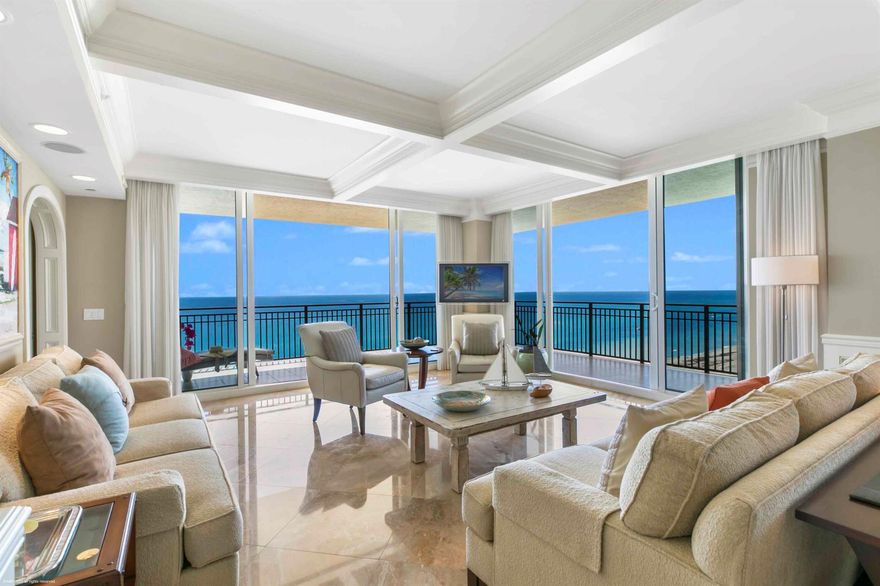 This rare 4 bedroom/5 bath ensuite, oceanfront gem at the Resort Residences of Singer Island, has spectacular direct, southeastern ocean and coastline views from every room. You can see south up the coastline as far as you can see all the way to the Breakers in Palm Beach. The immense wraparound terrace flaunts breathtaking, glowing views from sunrise to sunset! As a Master Builder's private residence, the entire domicile has been custom tailored. A private elevator opens directly into your home. From floor to ceiling you will feel the attention to architectural nuance. With Breccia Oniciata Marble tile at your feet and crown moldings, arches and coffered ceilings above your head, no detail has been spared. The Master bedroom suite has you living literally in the lap of luxury,