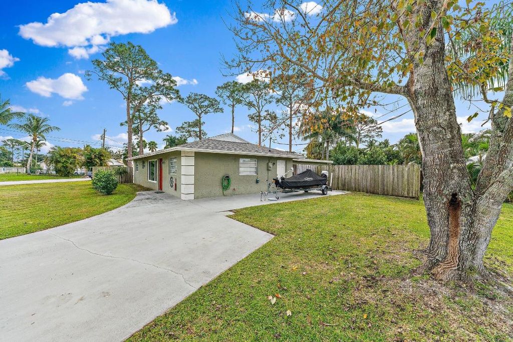 Photo of 5854 SE Orange Blossom Trail, Hobe Sound, FL 33455 (MLS # R10978446)