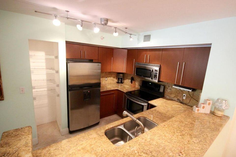 UPDATED UNIT WITH NEWER KITCHEN WITH GRANITE COUNTERTOPS, NEWER APPLIANCES AND UPDATED BATHROOMS. WOOD FLOORS IN LIVING ROOM , DINING AREA AND BEDROOMS. TILE IN KITCHEN AND ENTRANCE. FRESHLY PAINTED. VAULTED CEILING IN LIVING ROOM AND DINING AREA. RELAXING VIEWS OF TENNIS COURTS FROM ALL WINDOWS. AVAILABLE FOR LONG TERM BUT ONE YEAR AT A TIME. SUBDIVISION HAS JUST COMPLETED CONCRETE RESTORATION PAINTED. RENT INCLUDES WATER AND CABLE AND INTERNET.AMONG THE MANY AMENITIES ARE A POOL, TIKI BAR AND SPA ON THE INTRACOASTAL, 2 LEVEL STATE OF THE ART GYM, BUSINESS CENTER, CLUBHOUSE, TENNIS COURTS WITH NIGHT LIGHTS, MEDITATION POND, CHILDREN'S PLAYGROUND, DOG RUN, PLENTY OF OPEN SPACE AND GATED. PETS WELCOME BUT NO AGGRESSIVE BREEDS. UNIT COULD BE AVAILABLE MID SEPTEMBER IF NEEDED.