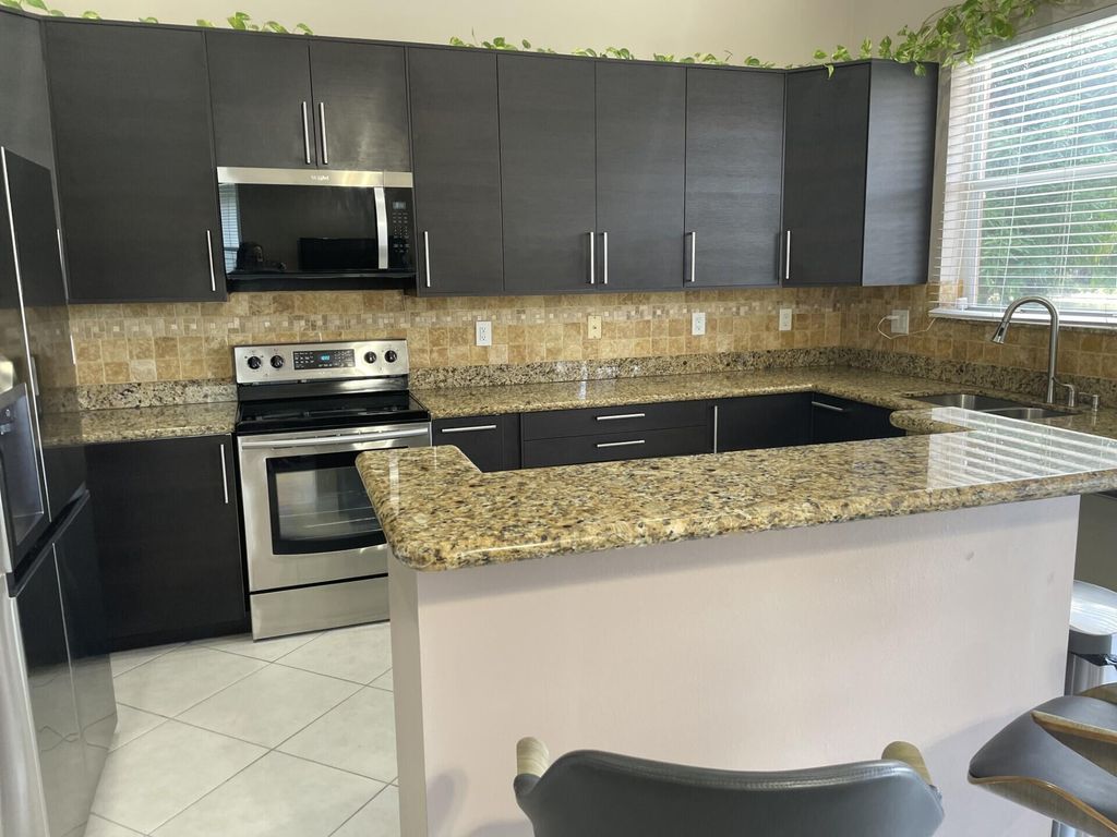 Photo of 9514 Lago Drive, Boynton Beach, FL 33472 (MLS # R11114163)