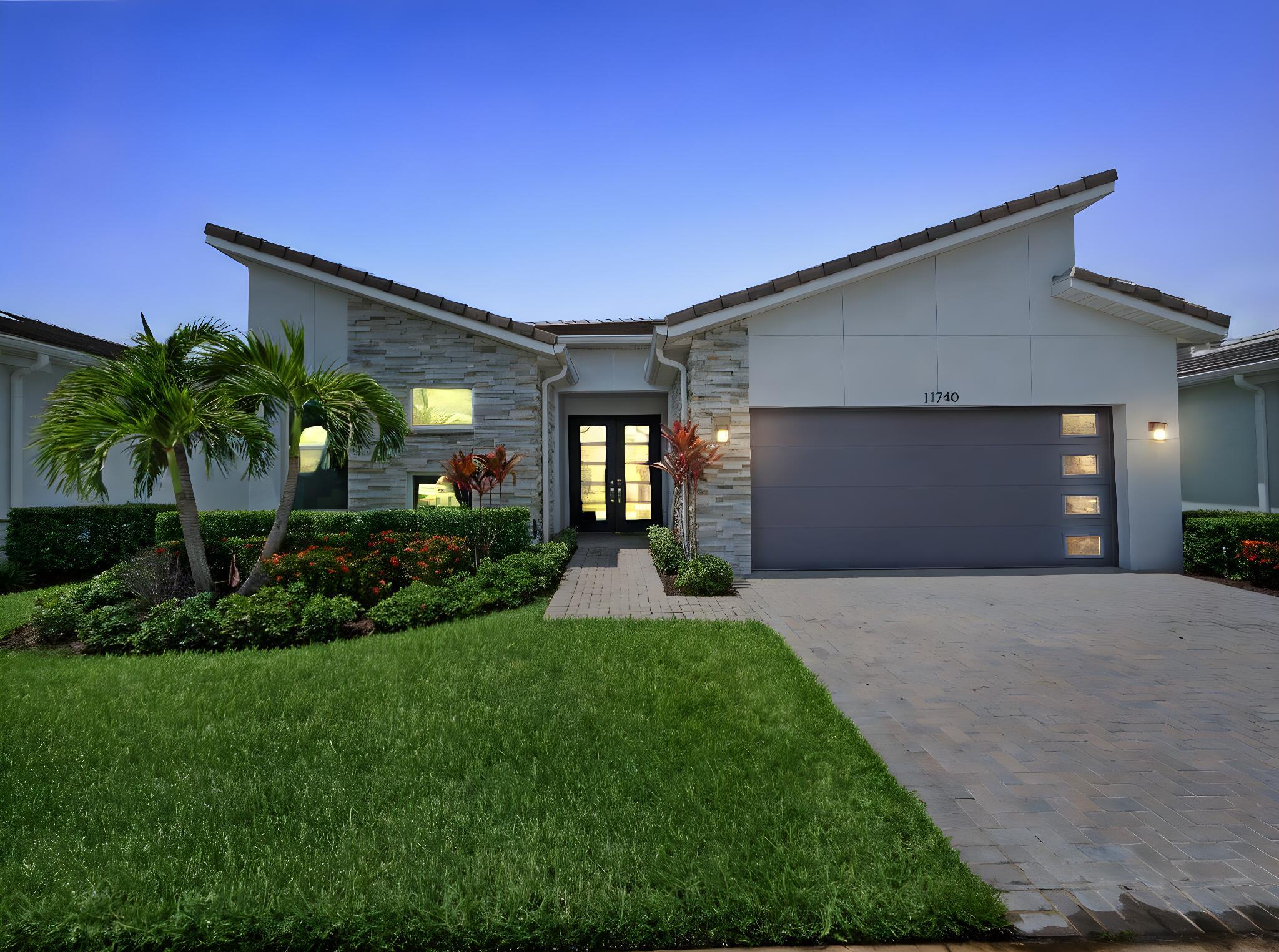 Stunning and extensively upgraded home in the 55+ community of Telaro at Tradition. This beautifully appointed residence features tile flooring throughout--no carpet--and an open-concept layout designed for modern living. The chef's kitchen boasts upgraded quartz countertops, a designer backsplash, stainless steel appliances, an upgraded glass-front refrigerator, wall ovens, an induction cooktop, and lighting both above and below the cabinets. Additional enhancements include extra recessed lighting, a programmable thermostat, and elegant lighting fixtures from Design Within Reach and West Elm. Bathrooms showcase square sinks, quartz surfaces, and an extra-large walk-in shower, plus added glass in the guest bath for a sleek finish.