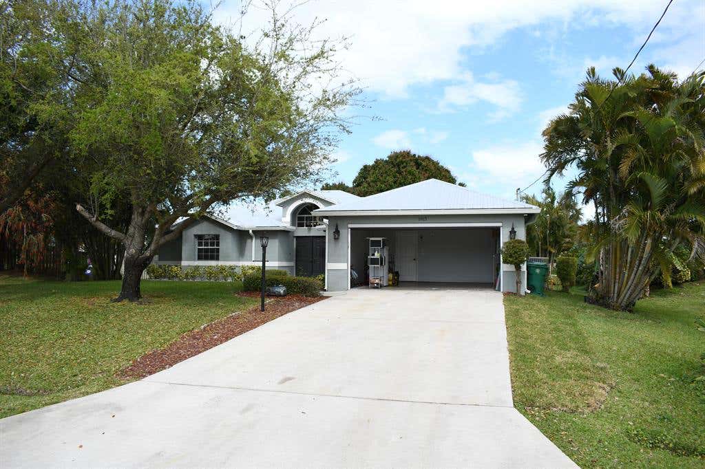 Photo of 1913 SW Castinet Lane, Port Saint Lucie, FL 34953 (MLS # R10700784)