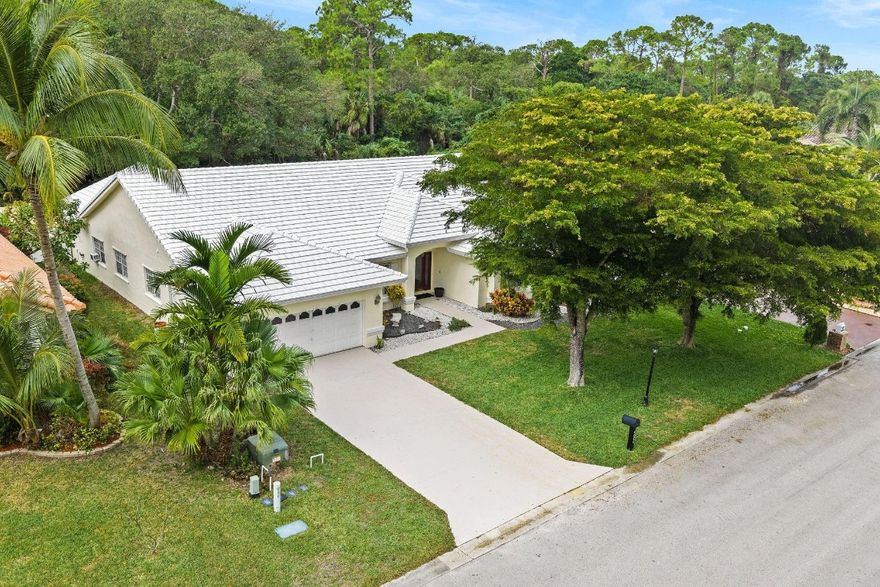 Located in the prestigious and private Carriage Pointe Estates, this rarely available one-story single-family home offers over 3,101 square feet under air with 5 bedrooms, 4 full bathrooms, a 2-car garage and volume ceilings. The home sits directly on Sandy Ridge Sanctuary, creating a natural, private setting with no rear neighbors. The fully fenced backyard includes plenty of green space, an in-ground pool resurfaced in 2016, and a 6-zone sprinkler system. Additional features include a tile roof, 24-hour manned security gate, wood flooring in the bedrooms, walk-in closets, and a very low HOA. Ideally located in the heart of Coral Springs, close to The Walk, Costco, Publix, and a wide selection of restaurants and parks! Don't Miss Out! Buyer to verify all info.