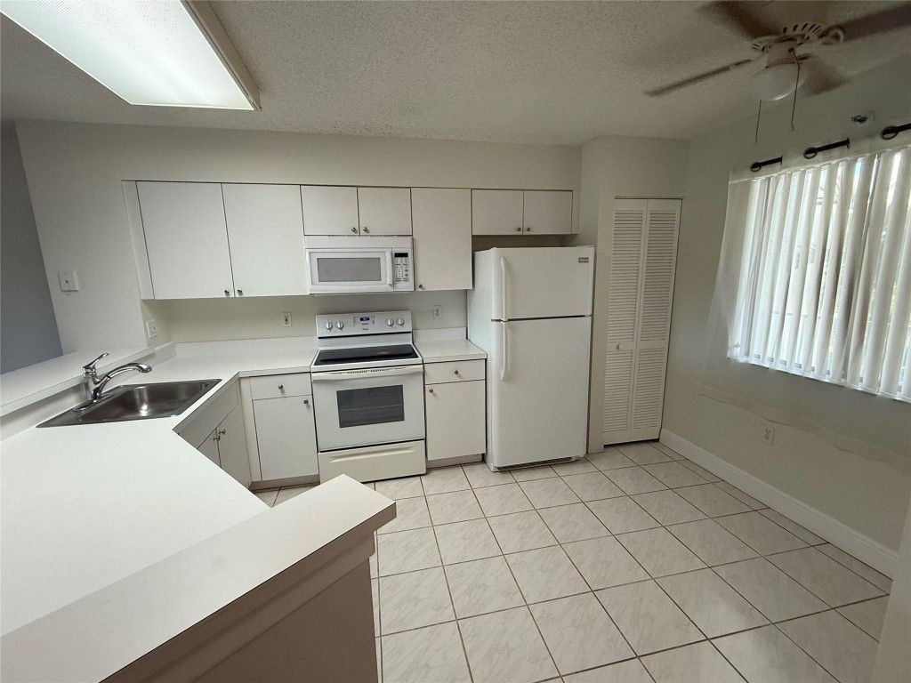 Photo of 2334 S Cypress Bend Drive #411, Pompano Beach, FL 33069 (MLS # F10532909)