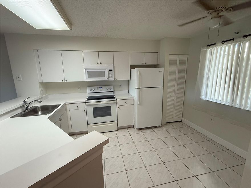 LARGE 1400SF CONDO OVERLOOKING THE LAKE! OPEN EAT-IN KITCHEN, WASHER & DRYER INSIDE UNIT, SCREENED BALCONY.  EXTRA STORAGE ROOM WITH CONDO! SMALL PET ALLOWED.  LAMINATE WOOD FLOORS, NO CARPET! JUST PAINTED AND READY TO GO!