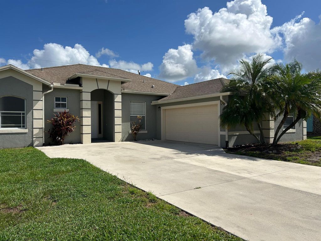 Photo of 1573 SW Merchant Lane, Port Saint Lucie, FL 34953 (MLS # R11119315)