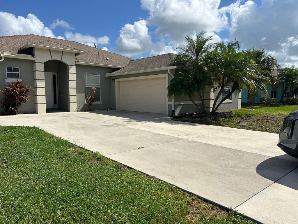 Photo of 1573 SW Merchant Lane, Port Saint Lucie, FL 34953 (MLS # R11119315)