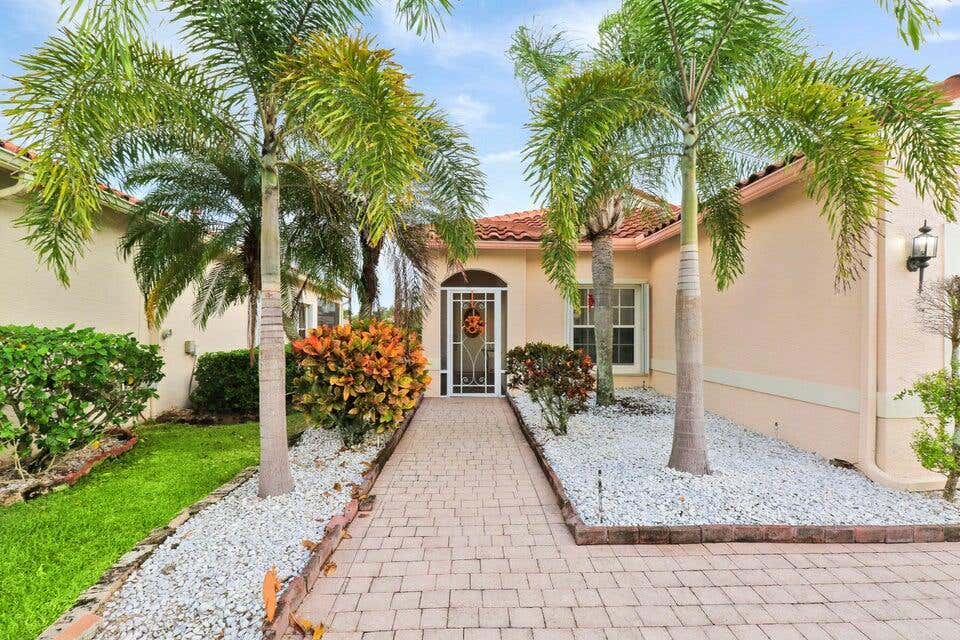 Photo of 319 NW Alana Avenue, Port Saint Lucie, FL 34986 (MLS # R10941895)