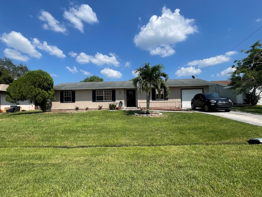 Photo of 885 SE Odonnell Lane, Port Saint Lucie, FL 34983 (MLS # R10834298)
