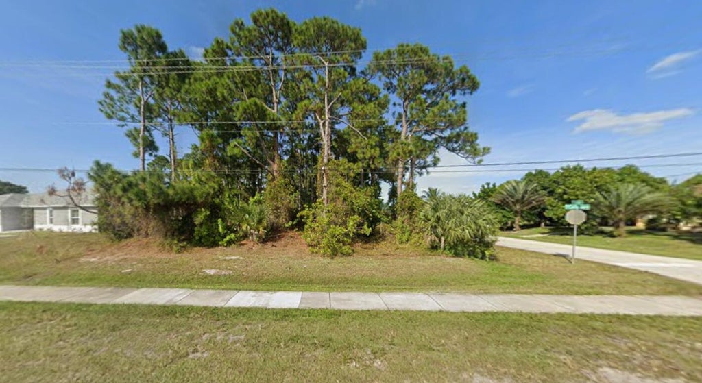 Photo of 801 SW California Boulevard, Port Saint Lucie, FL 34953 (MLS # B26038175)