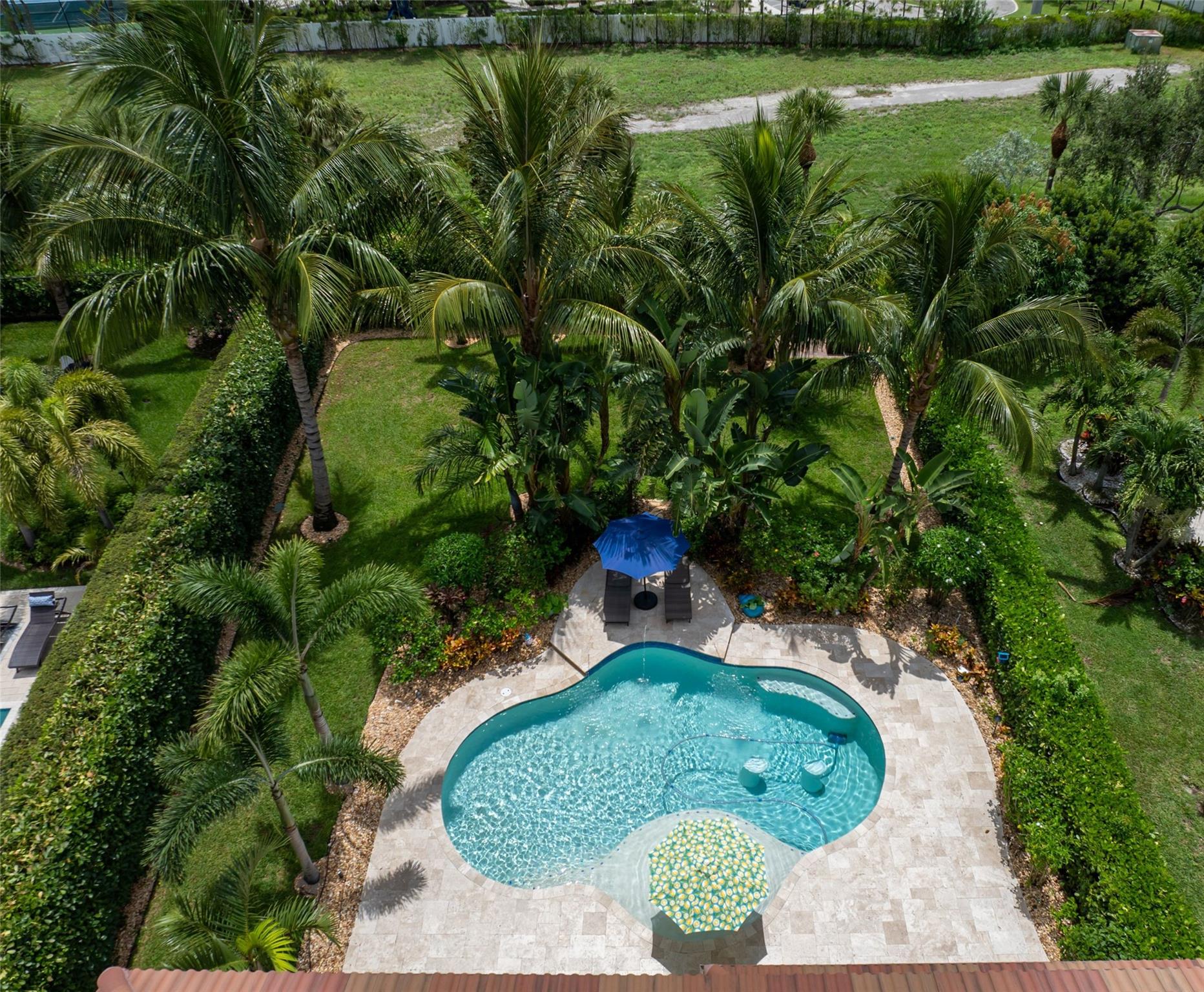 Welcome home! Your two-story, private tropical oasis offers a large, fenced, & beautifully landscaped yard, outdoor kitchen, covered patio with automated screen enclosure offering the ultimate outdoor living & entertaining space. Interior open, airy main living areas on the first floor, kitchen & powder room. You’ll find laundry room & all 3 bedrooms on 2nd floor. Be the envy of all your friends with a super-spacious master bedroom, custom walk-in closet, private ensuite, & view overlooking the pool. The loft is an ideal office, den, or may be converted to a fourth bedroom. Enjoy comfort and peace of mind with impact windows and doors, 2022 New HVAC system, a whole-house generator with a 320-gallon buried propane tank, and an alarm system. The driveway fits 4 vehicles, No Rear Neighbors!