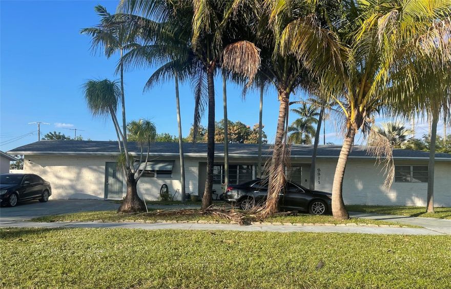 Lots of potential but does need work.  Huge Florida Room in the middle of this U-shaped floor plan with screen enclosed oversized pool.  Two large separate kitchens.  Formal dining room.  Corner property with alley in back for garage access.  No offers considered sight unseen.