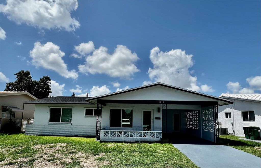 Photo of 6710 NW 62nd St, Tamarac, FL 33321 (MLS # F10449054)