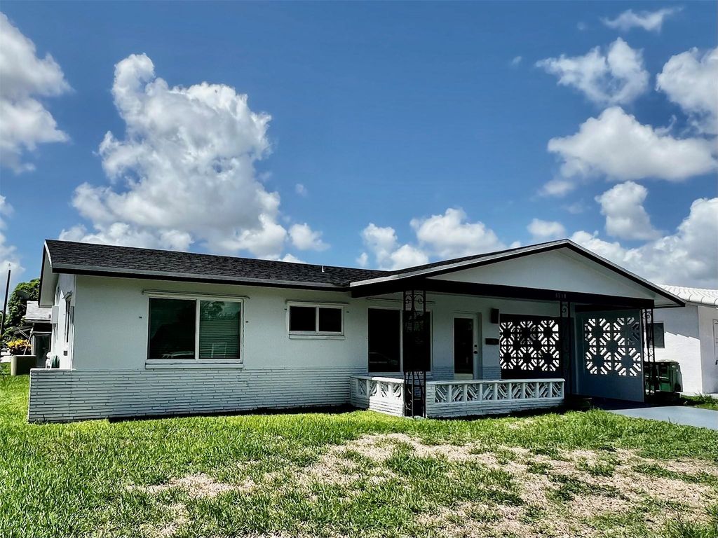 Photo of 6710 NW 62nd St, Tamarac, FL 33321 (MLS # F10449054)