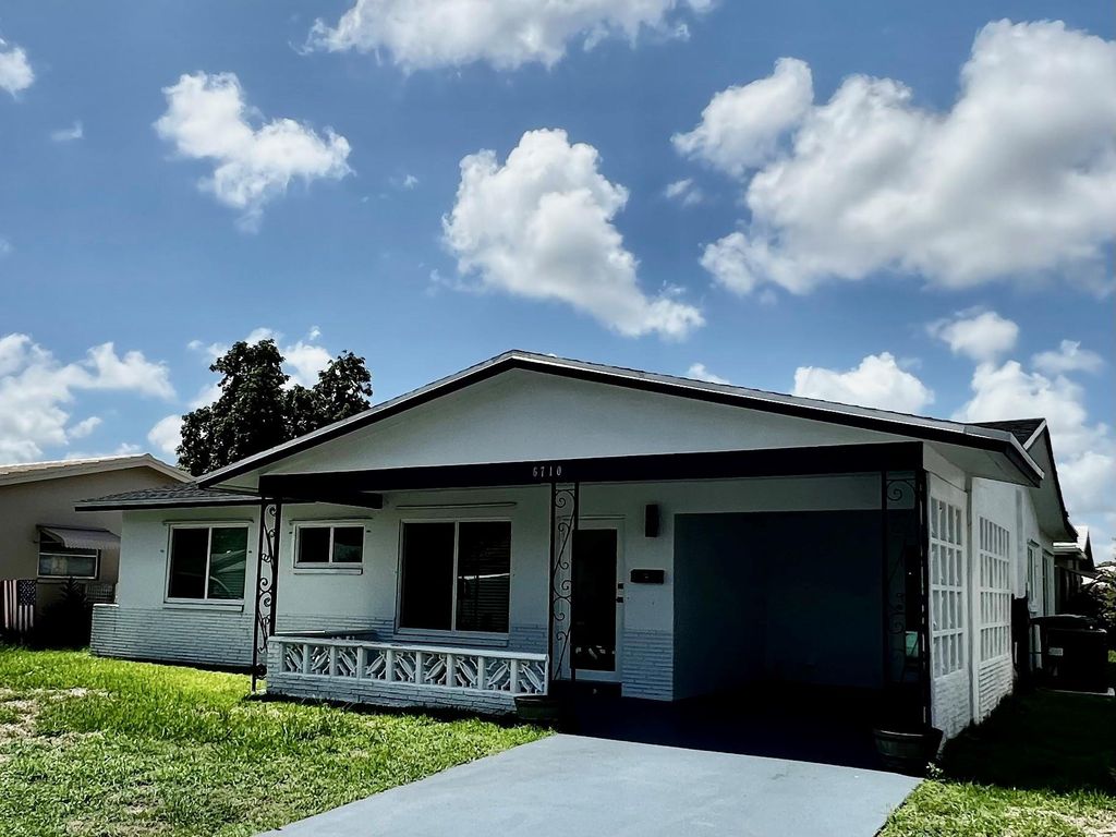 Photo of 6710 NW 62nd St, Tamarac, FL 33321 (MLS # F10449054)