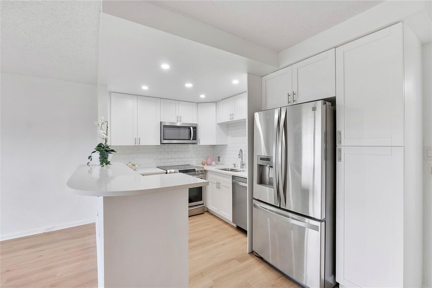 Beautiful & spacious fully renovated 1 bedroom, 1 and 1/2 bath with screened balcony offers a beautiful view across the expansive manicured garden. Perfect for snowbird or year-round living, ASSOC. says 55+ community and at least one occupant must be age 55 or over. Maintenance includes water, sewer, waste, basic cable, security, internet. Amenities include a gated Century Village resort-living, fitness center, swimming pools, live shows, movies, bus service, classes, bingo, card rooms, tennis courts, 2 houses of worships. Close to shopping and restaurants. You also have a storage bin in the laundry room. **Great investment opportunity that can be rented  immediately. **