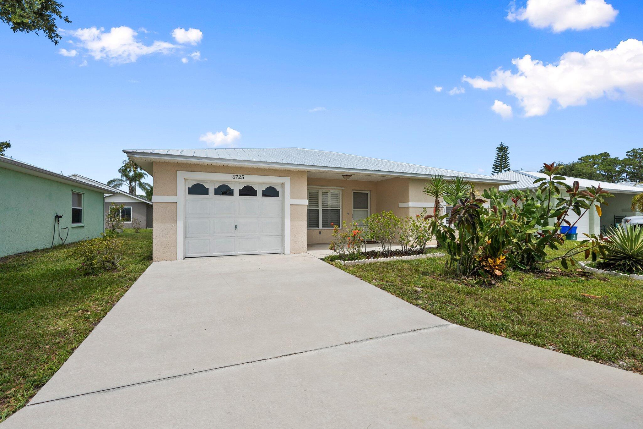 Charming 2-Bed, 2-Bath CBS Home in Spanish Lakes Fairways - Pet Friendly & Packed with Amenities! NEW metal roof and a 10x16 screened in patio are just a few of the highlights. Step inside to find a bright and inviting layout with newer fans, laminate flooring & plantation shutters. Your monthly land lease includes access to: Two heated swimming pools for year-round enjoyment, Tennis & pickleball courts. Shuffleboard, bocce, and a vibrant clubhouse for social gatherings & golf!