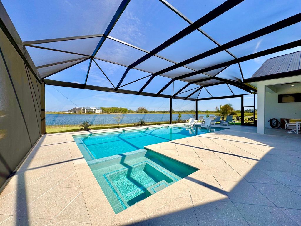 Photo of 7001 SW Pentalago Circle, Palm City, FL 34990 (MLS # B26007687)