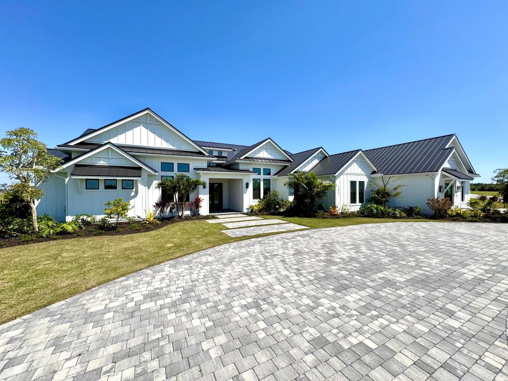 Photo of 7001 SW Pentalago Circle, Palm City, FL 34990 (MLS # B26007687)