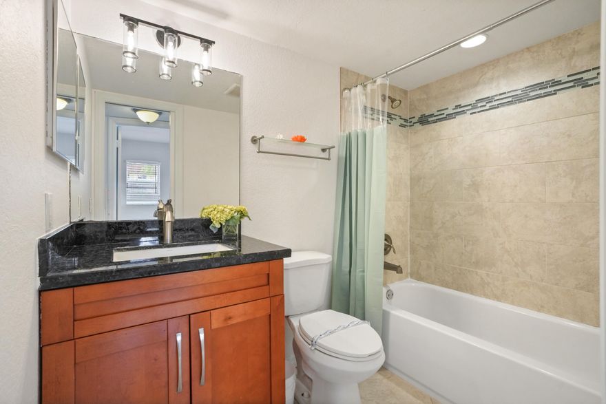 Beautifully remodeled first-floor corner unit in the desirable 55+ Sunrise Lakes community. Bright and spacious with an open floor plan, granite countertops, and abundant natural light. Features 2 bedrooms with walk-in closets, new A/C, and assigned parking directly in front of the unit. Enjoy serene water views and resort-style amenities including pool, clubhouse, fitness center, golf, and more. Conveniently located near shopping and dining.