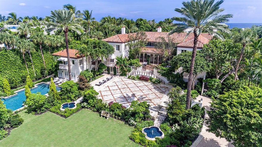 1928 Marion Sims Wyeth designed landmark home is located in the estate section on a 36,246 sf lot. The oversized landscape and gardens were designed by celebrity landscape architect Harry Nelson while the structure was stunningly renovated inside and out by Todd Michael Glaser. Only two houses from the ocean, this Mediterranean estate is comprised of 8 bedrooms, 9 baths and 2 half baths and totals 12,641 sf. The impressive great room boasts a ceiling height over 25' with beautifully stenciled Pecky Cypress adding to the allure of this authentic Wyeth estate. Interior features include 3 fireplaces, 2 beautifully enclosed galleries, an elevator, sauna, wine cellar, massage and fitness room, separate guest house, poolside cabana, full house generator, cooling tower and deeded beach access.