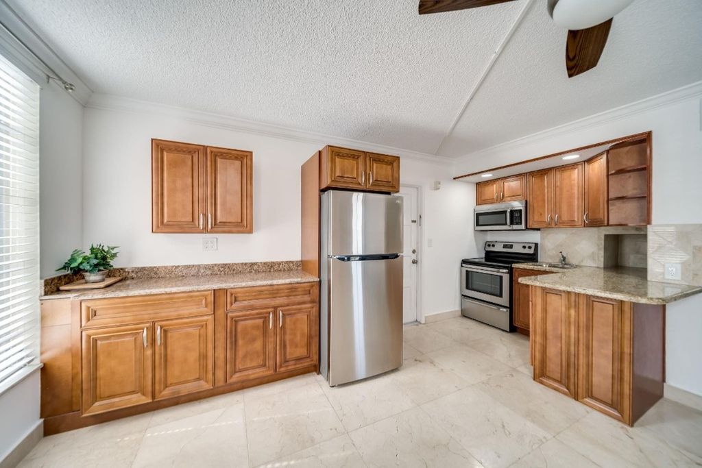 Photo of 2601 S Course Drive #201, Pompano Beach, FL 33069 (MLS # F10428095)