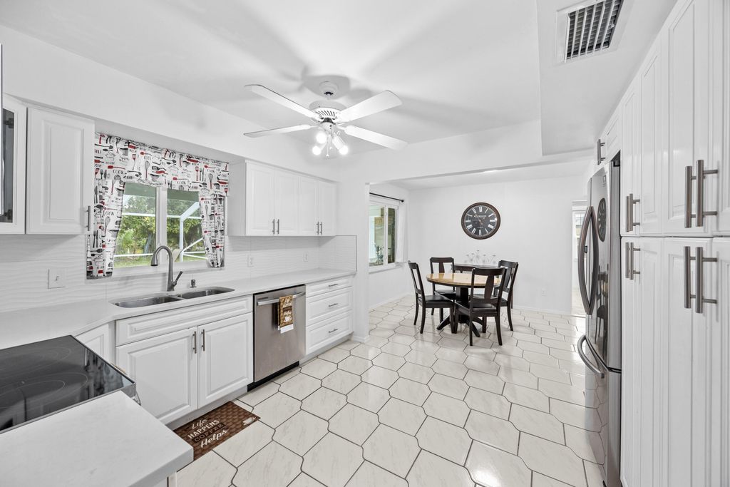 Photo of 1742 W Terrace Drive, Lake Worth Beach, FL 33460 (MLS # R11164252)