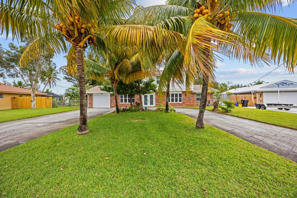 Photo of 1742 W Terrace Drive, Lake Worth Beach, FL 33460 (MLS # R11164252)