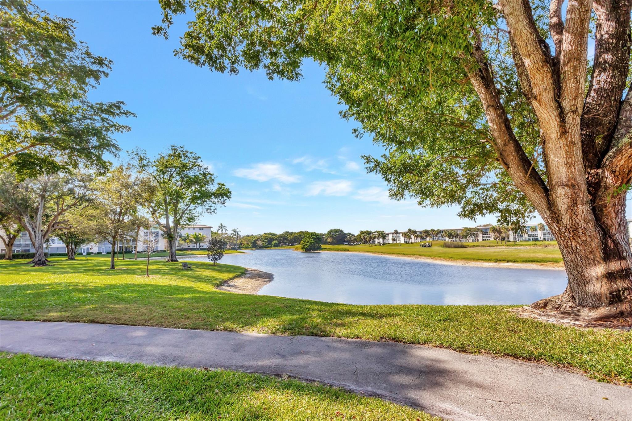 JUST REDUCED!!-SPECTACULAR CORNER UNIT, 2 MASTER BEDRMS & 2 MASTER BATHRMS. UPDATED BEAUTIFUL HOME IS WHAT YOU WANT. SELLER SPARED NO EXPENSE. IMPACT FRONT DOOR & WINDOWS. FINEST MATERIALS & CREATIVITY. SPACIOUS OPEN CONCEPT KITCHEN WITH SS APPLIANCES & GRANIT COUNTERTOPS & SLEEK CUSTOM CABINETRY. WATER VIEWS FROM YOUR ENCLOSED BALCONY IS SERENE & INVITING YOU TO RELAX AT THE END OF THE DAY SIPPING A GLASS OF WINE OR WAKE UP TO THE SUN CALLING YOUR NAME. WYNMOOR IS A GOLF COMMUNITY WITH NO EXORBITANT GOLF FEES. FREE CABLE TV, FREE BUS SERVICE, $2 FIRST RUN MOVIES, REST. ON SITE, PICKLEBALL, TENNIS, THEATER, DANCES, BAR-B-Q WITH A DJ FOR YOUR DANCING PLEASURE, BILLARDS, EXERCISE FACILITY, ARTS & CRAFTS ETC, SIGNED FIRPTA REQUIRED. 6 MILES TO POMPANO BEACH-RESTAURANTS, SHOPS & PARKING.