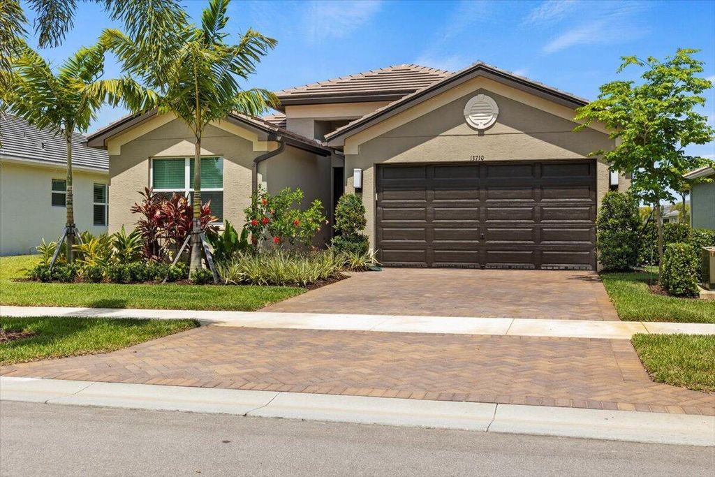 Photo of 13710 SW Oceanus Boulevard, Port Saint Lucie, FL 34987 (MLS # R10993517)
