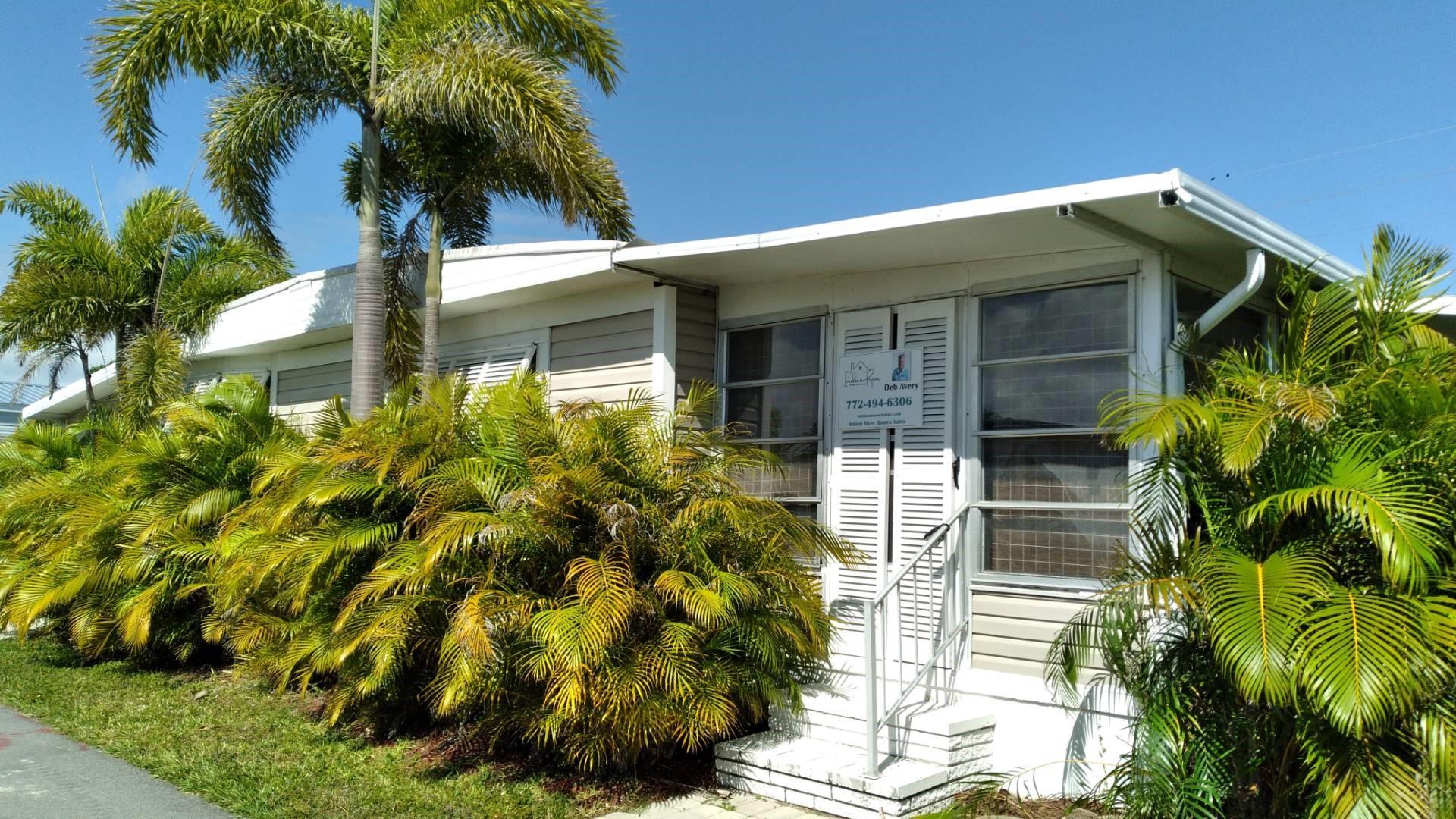 Home with a dock just a few feet from the Indian River Lagoon. Do you fish? Kayak? There is a dock that currently has a pontoon boat tied up. 2/2 with garage...Come on Make it your own. Fairlane Harbor has great amenities like pickleball, a pool, two BBQ areas and more. Gated community and only minutes to SouthBeach or 5 minutes to Downtown Vero.