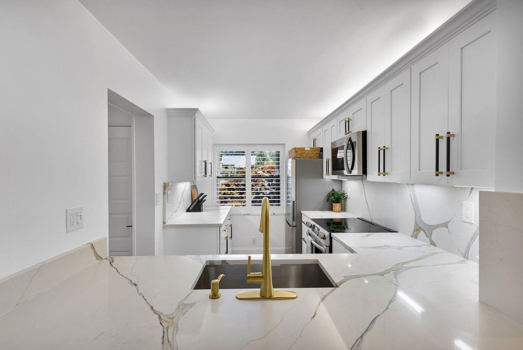 Photo of 12911 Briarlake Drive #103, Palm Beach Gardens, FL 33418 (MLS # R11165788)