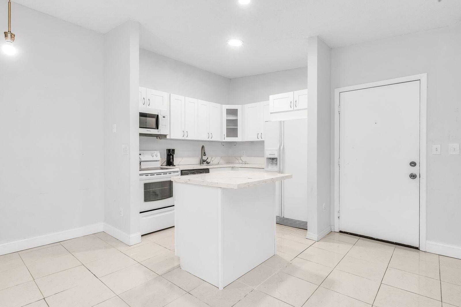 TAMARAC GARDENS CONDOMINI - Residential Lease