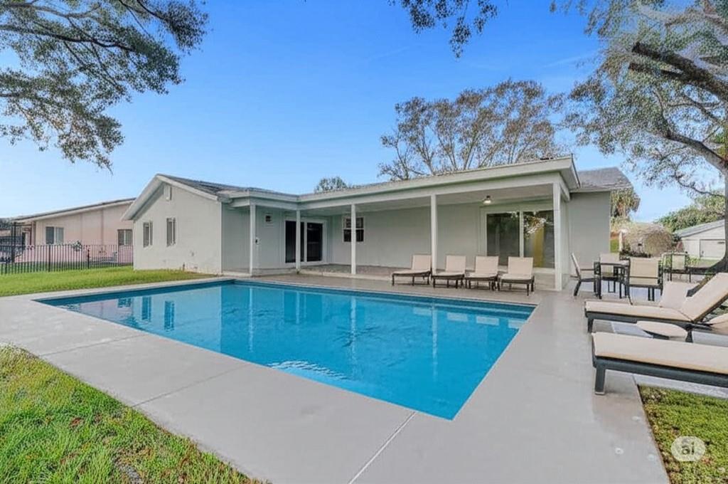 Fully renovated and fully permitted! This stunning 3-bed, 2-bath home in North Plantation Acres wows with an open layout, sleek quartz countertops, new cabinets, and top-tier stainless steel appliances. 2023 roof. Both bathrooms shine with modern tile, glass showers, and quartz vanities. Enjoy peace of mind with all-new impact windows and doors, updated A/C, electrical, and LED lighting throughout. Gorgeous wood-look porcelain floors, new fans, and blinds add style. Set on a ¼-acre lot, the private backyard and covered porch are perfect for relaxing or future pool plans. No HOA, 2-car garage, and close to highways, dining, parks, and shopping! Virtual pool and furniture for reference only.