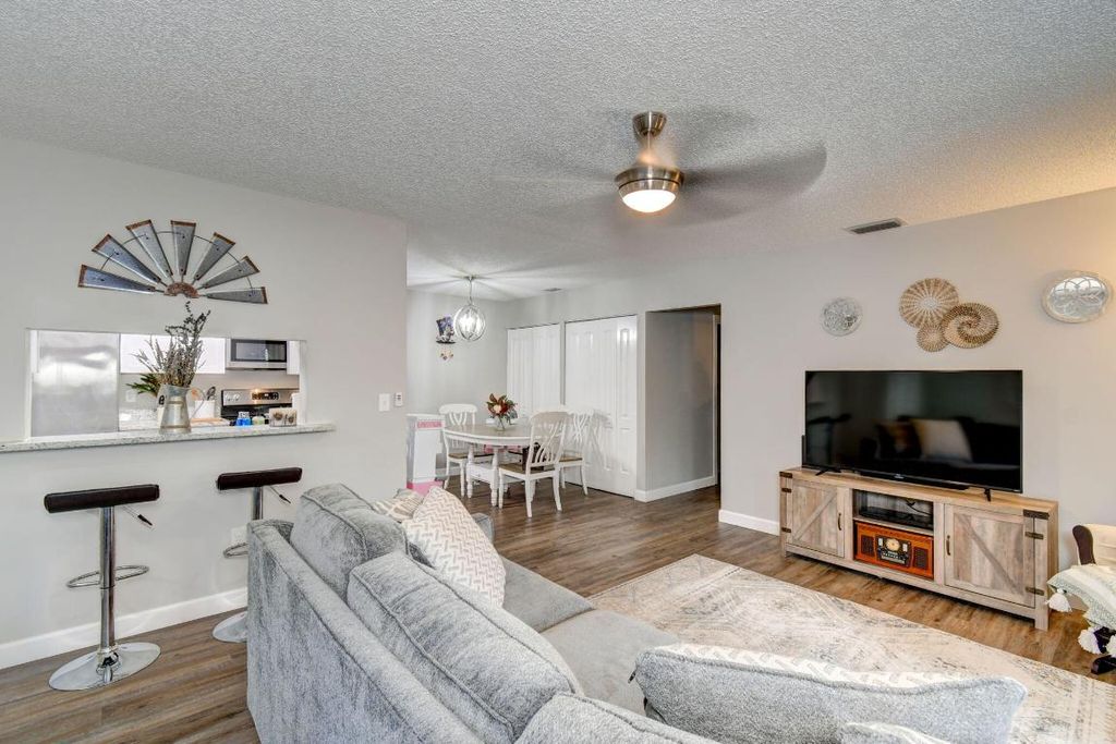 Photo of 4089 NW Cinnamon Tree Circle, Jensen Beach, FL 34957 (MLS # R10941827)